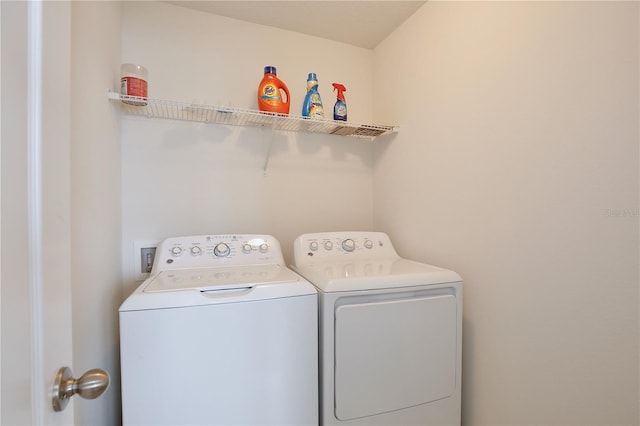 laundry area with washing machine and dryer