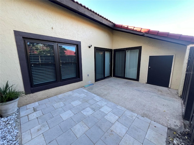 view of patio terrace at dusk