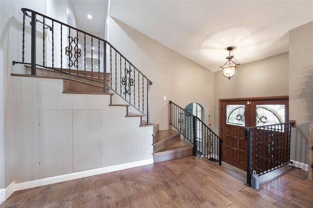 foyer featuring hardwood / wood-style floors and french doors