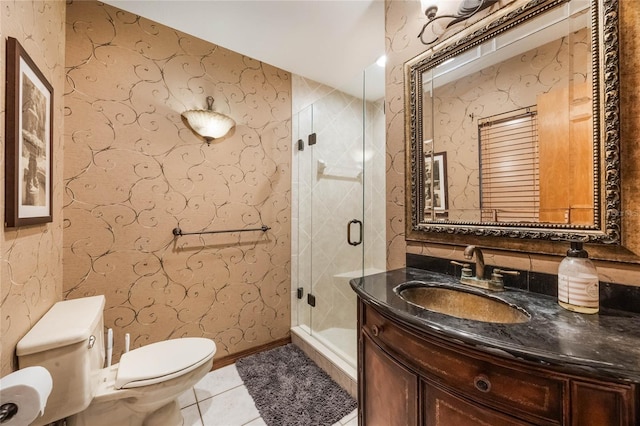 bathroom with tile patterned flooring, vanity, toilet, and a shower with shower door