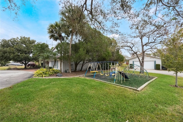 exterior space featuring an outdoor structure, a garage, and a playground