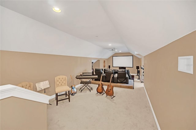 interior space with lofted ceiling and light colored carpet