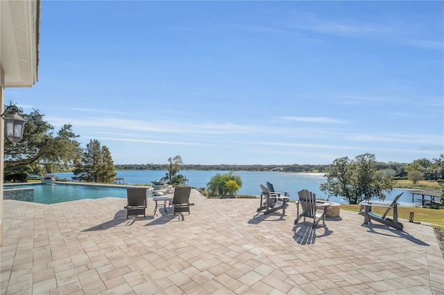 view of patio with a water view