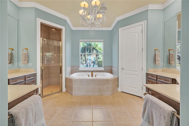 bathroom with independent shower and bath, ornamental molding, vanity, a notable chandelier, and tile patterned floors