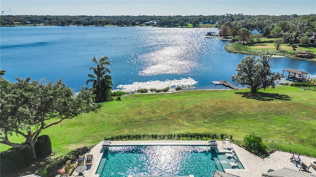 birds eye view of property with a water view