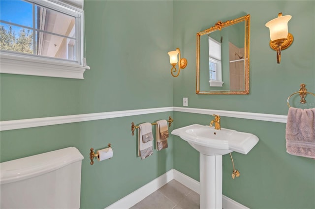 bathroom with tile patterned floors and toilet