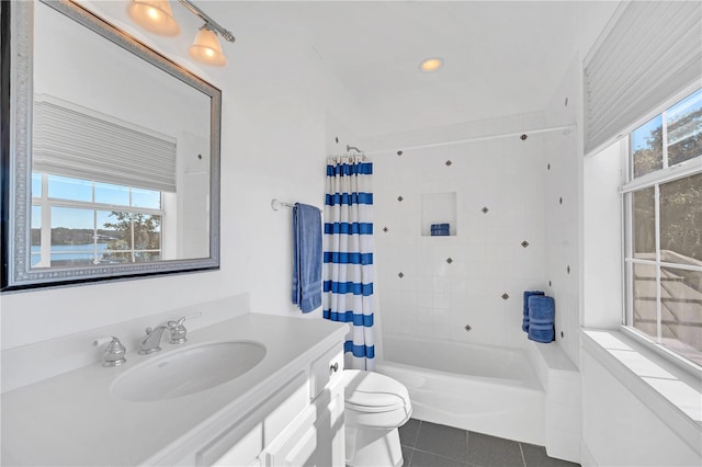 full bathroom with shower / tub combo with curtain, vanity, toilet, and tile patterned flooring