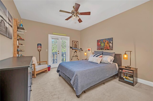 carpeted bedroom featuring access to outside, ceiling fan, and french doors