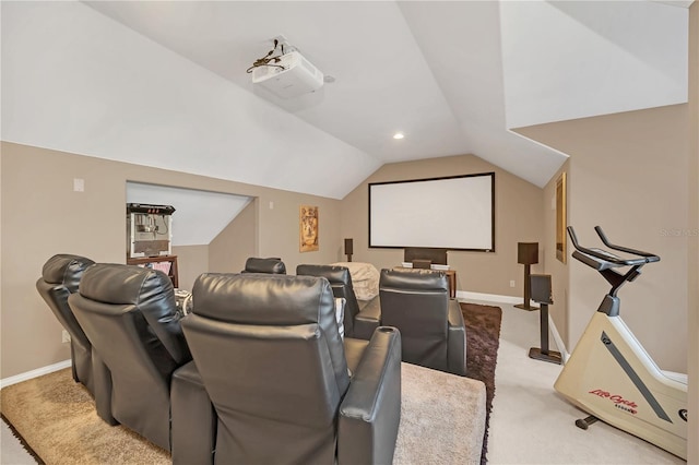 home theater with vaulted ceiling and light colored carpet