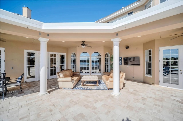 view of patio with outdoor lounge area, ceiling fan, and french doors