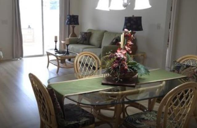 dining space with light hardwood / wood-style flooring