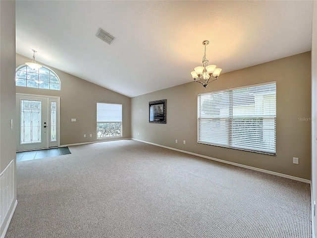 interior space with a chandelier and vaulted ceiling