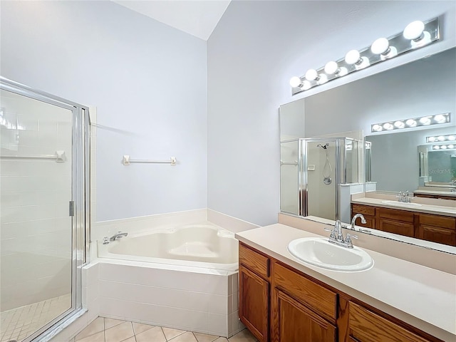 bathroom featuring tile patterned floors, vanity, and independent shower and bath