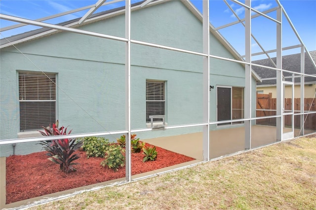 view of property exterior with a lanai