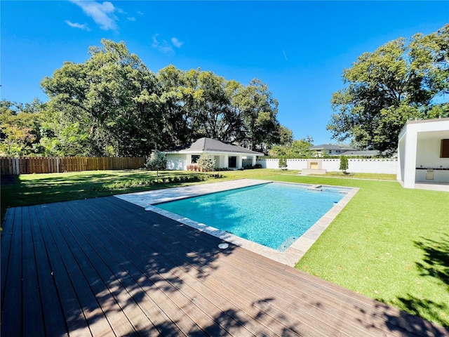 view of pool featuring a yard and a wooden deck