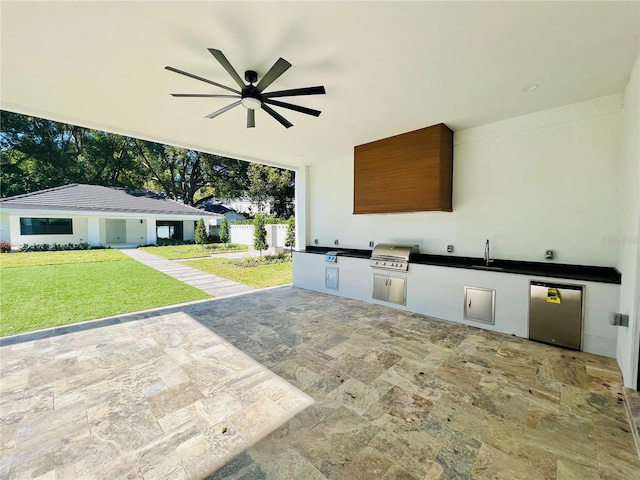 view of patio / terrace with a grill, ceiling fan, sink, and an outdoor kitchen