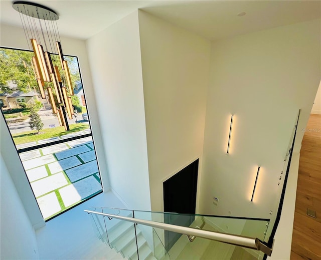 staircase with hardwood / wood-style floors