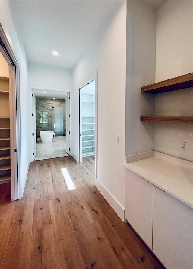 hallway featuring light hardwood / wood-style flooring