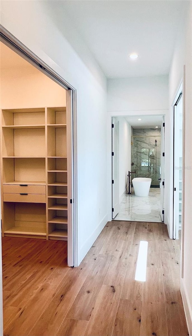 hallway featuring hardwood / wood-style floors