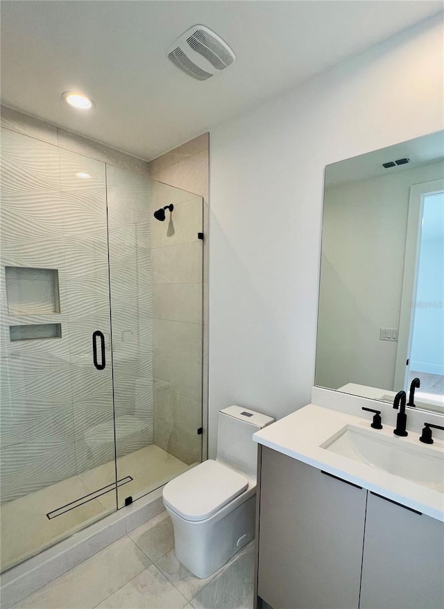 bathroom with walk in shower, tile patterned flooring, vanity, and toilet