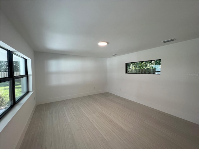 spare room with light wood-type flooring