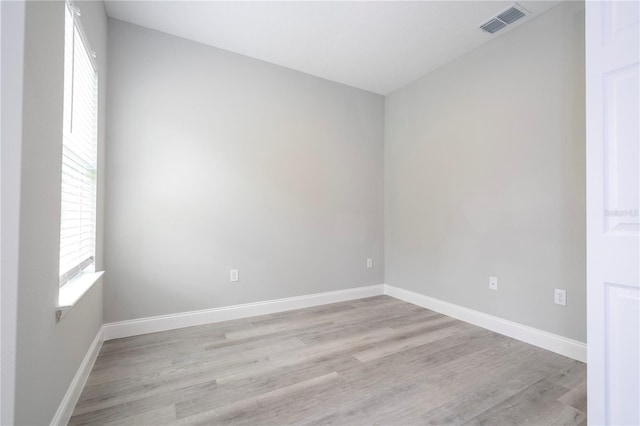 spare room featuring light hardwood / wood-style flooring