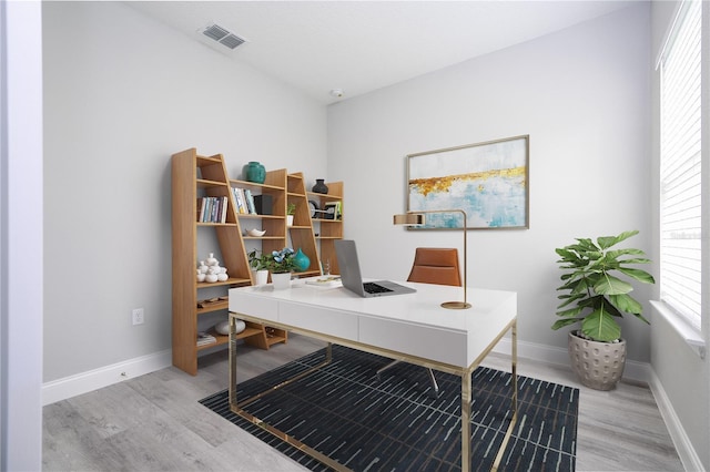 office space with light hardwood / wood-style floors