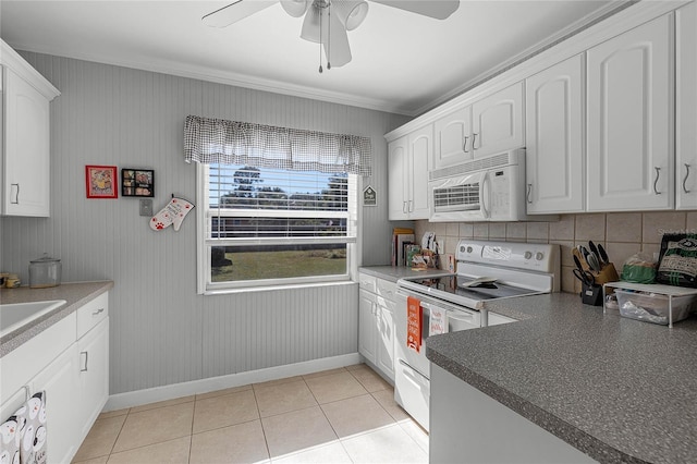 kitchen featuring white appliances, white cabinets, ceiling fan, light tile patterned floors, and tasteful backsplash