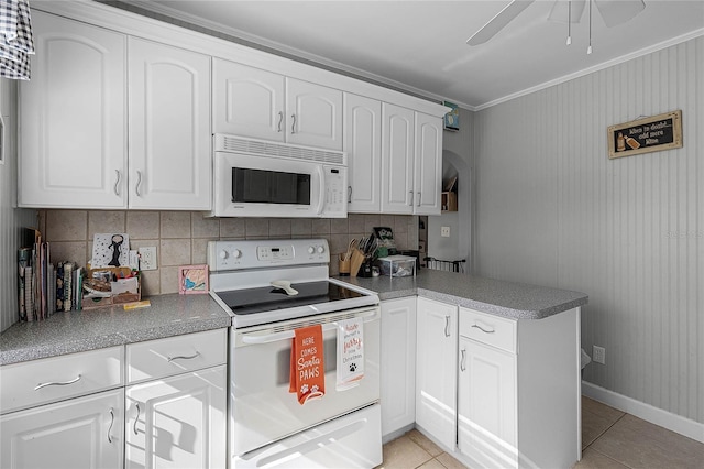 kitchen featuring white appliances, kitchen peninsula, ceiling fan, light tile patterned floors, and white cabinetry