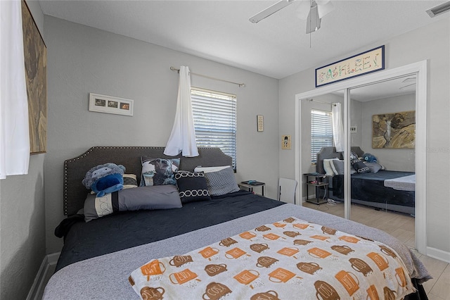 bedroom featuring a closet and ceiling fan