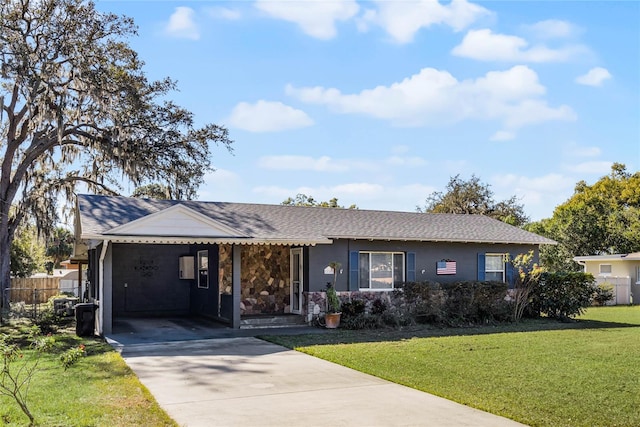 ranch-style home with a carport and a front yard