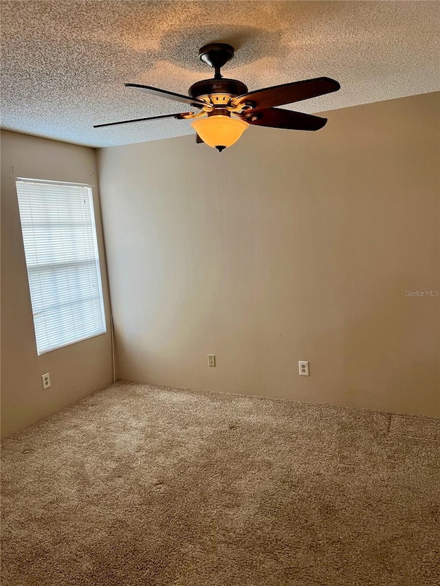 485 Forestway Cir Unit 202, Altamonte Springs, FL 32701 - spare room featuring carpet, a textured ceiling, and a ceiling fan