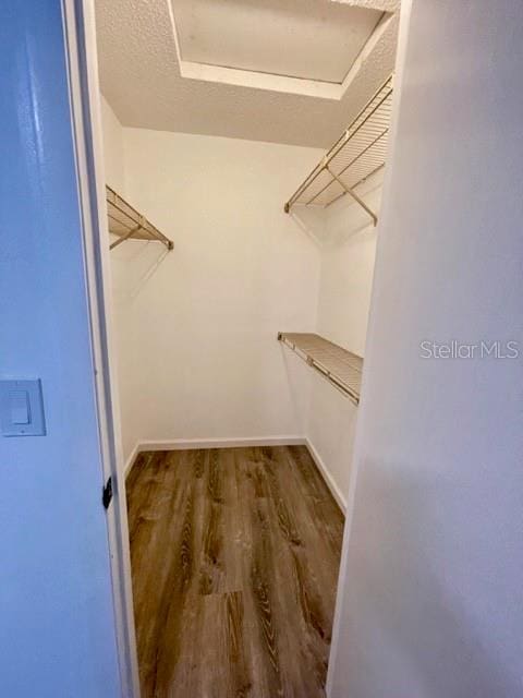315 Lakepointe Dr Unit 302, Altamonte Springs, FL 32701 - spacious closet featuring wood finished floors