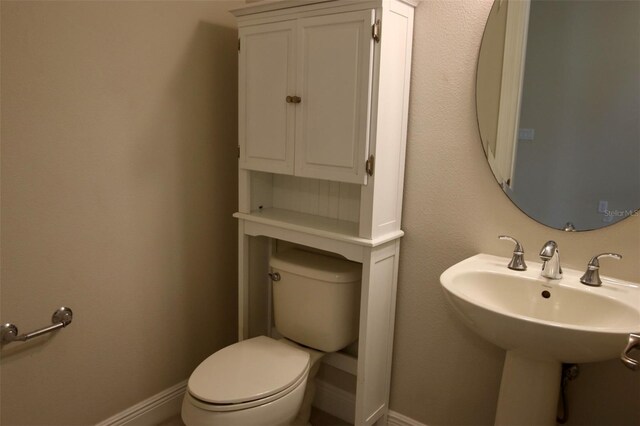 bathroom with sink and toilet