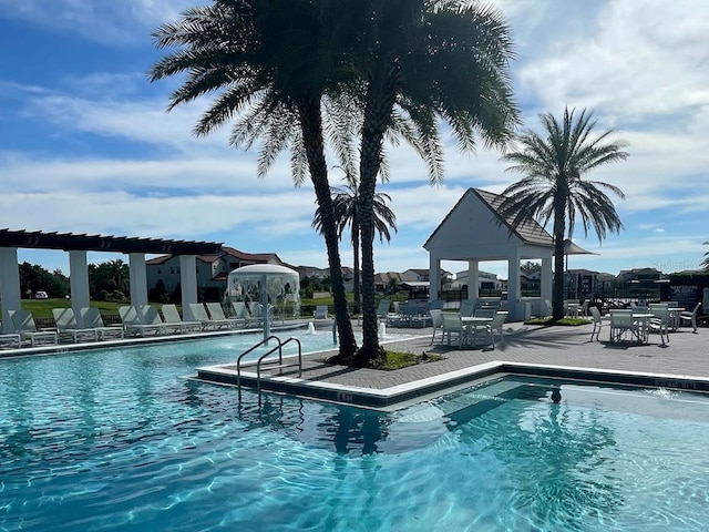 view of swimming pool featuring a patio area