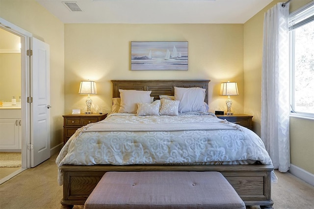 bedroom featuring light carpet