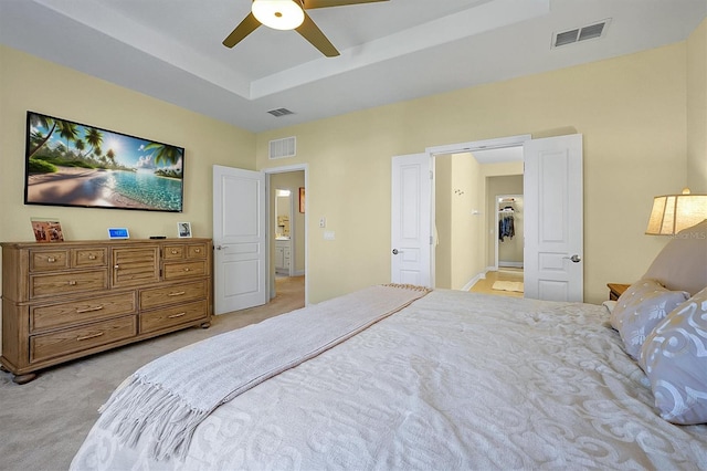 bedroom with ceiling fan and light colored carpet