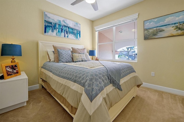 bedroom featuring ceiling fan and carpet floors