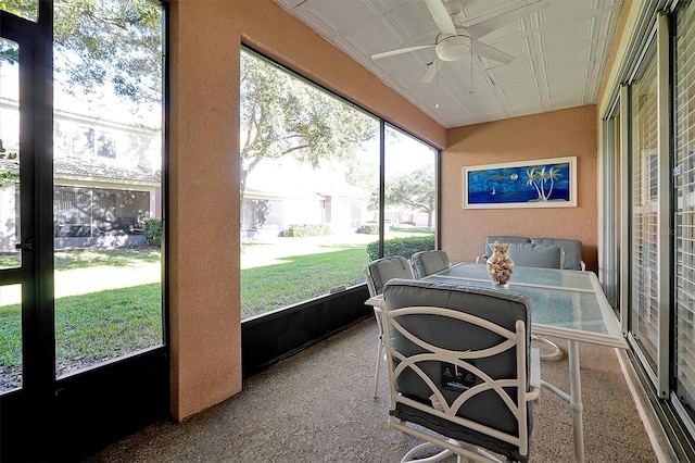 sunroom featuring a wealth of natural light and ceiling fan