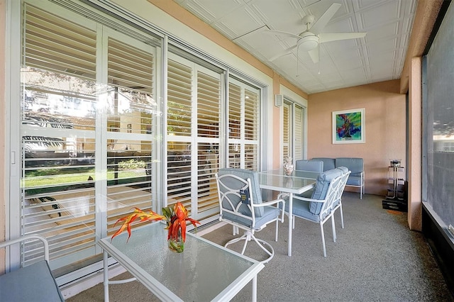 sunroom / solarium with ceiling fan and a wealth of natural light