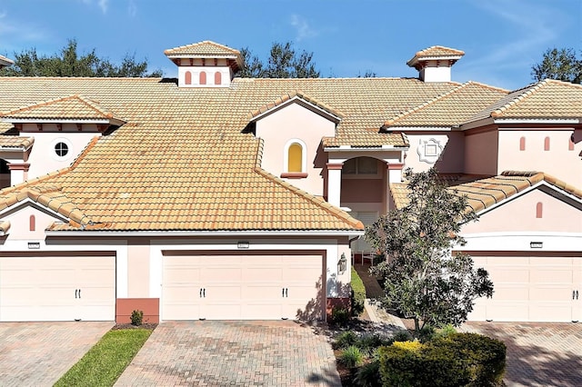 mediterranean / spanish-style home featuring a garage