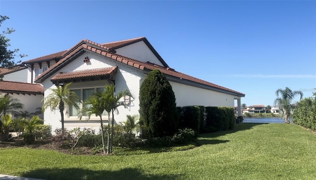 view of property exterior featuring a yard