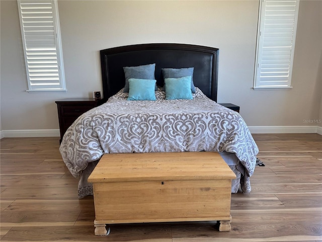 bedroom featuring wood-type flooring