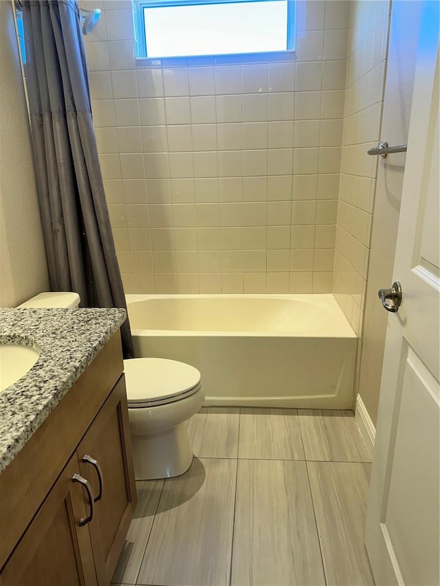 full bathroom featuring vanity, toilet, and shower / tub combo