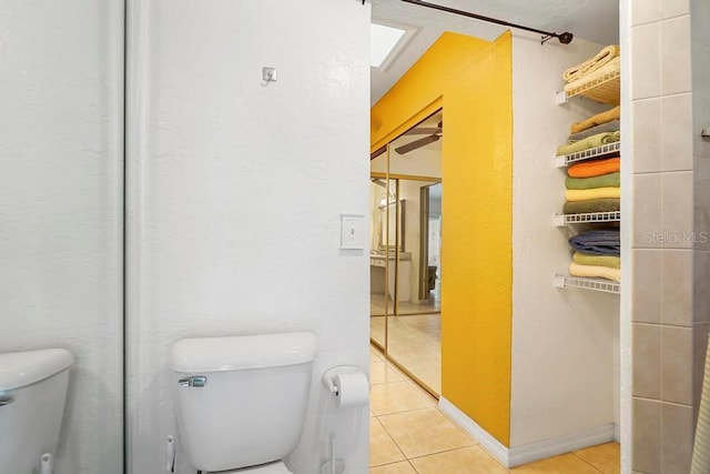 bathroom with tile patterned floors and toilet