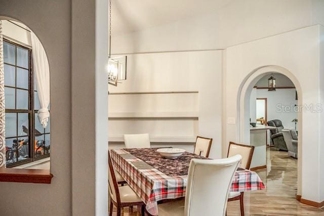 dining area featuring a chandelier and hardwood / wood-style floors