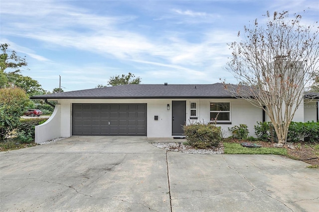 ranch-style home featuring a garage