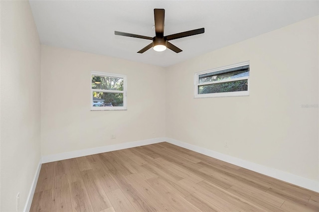 unfurnished room with ceiling fan and light hardwood / wood-style flooring