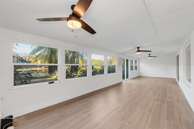 unfurnished sunroom featuring plenty of natural light