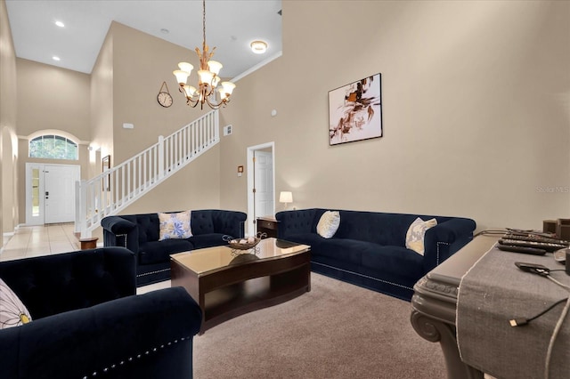 living room featuring a high ceiling, light colored carpet, and an inviting chandelier